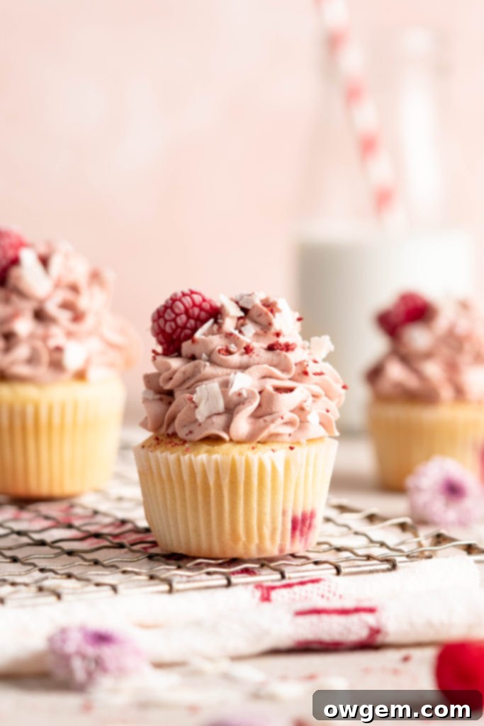 Raspberry Coconut Cupcakes with raspberry whipped cream topping