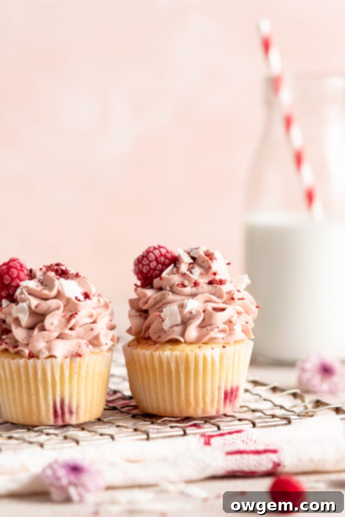 Raspberry Coconut Cupcakes with raspberry whipped cream topping