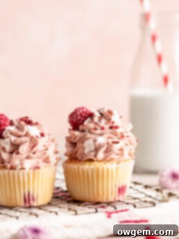 Raspberry Coconut Cupcakes with raspberry whipped cream topping
