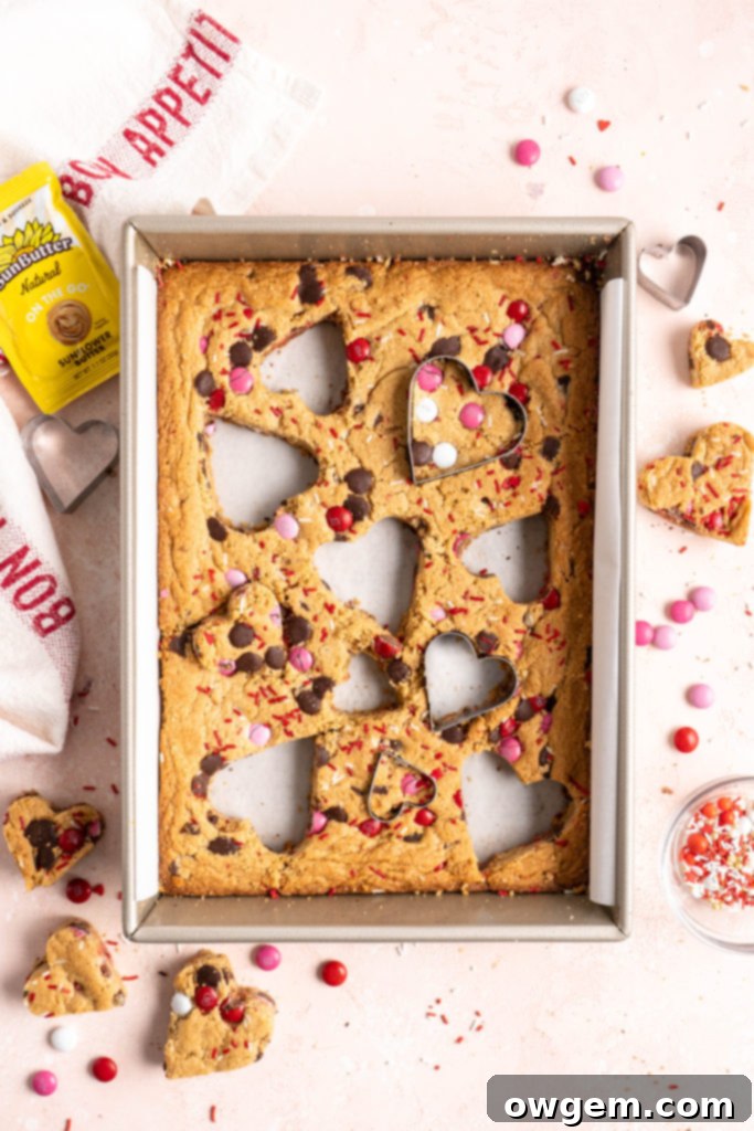 Heart shaped chewy one bowl SunButter m&m blondies with colorful M&Ms