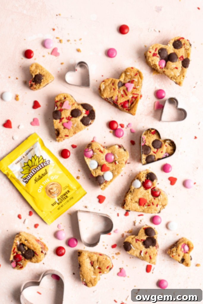 Heart shaped chewy one bowl SunButter m&m blondies arranged on a plate