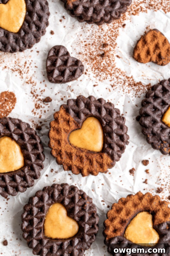 A delicious chocolate peanut butter cookie sandwich, with the heart cutout revealing the creamy filling.