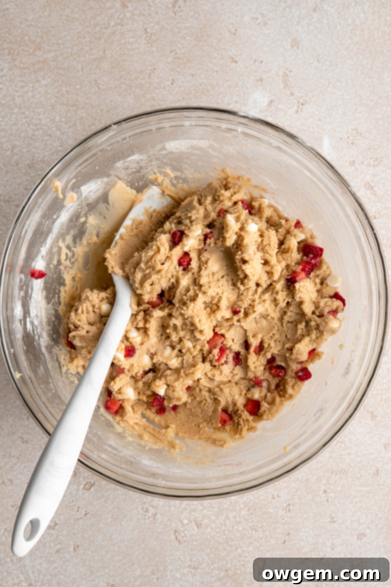 Strawberry shortcake cookie dough after strawberries and white chocolate are folded in
