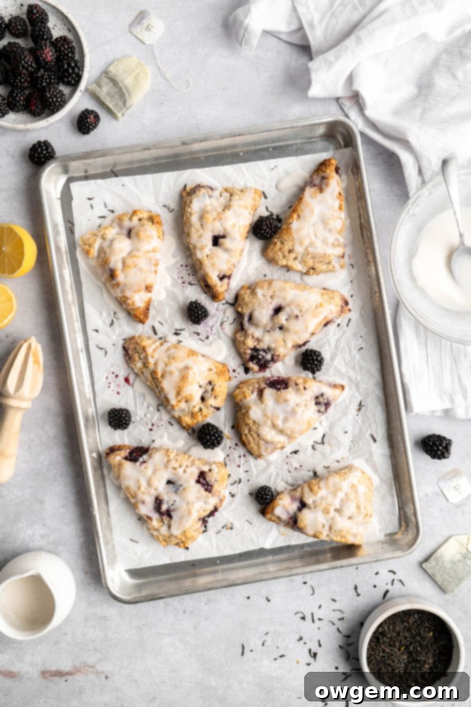 Another view of blackberry earl grey scones covered in vanilla glaze