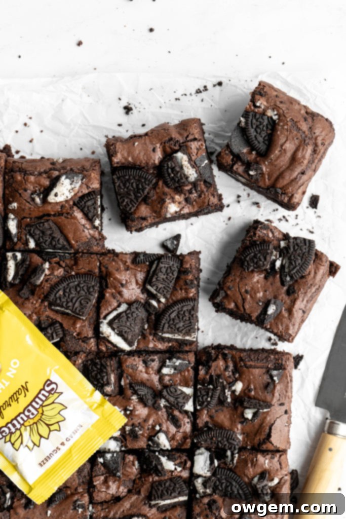 Crinkly top brownies with Oreos on top, with a SunButter package prominently displayed.