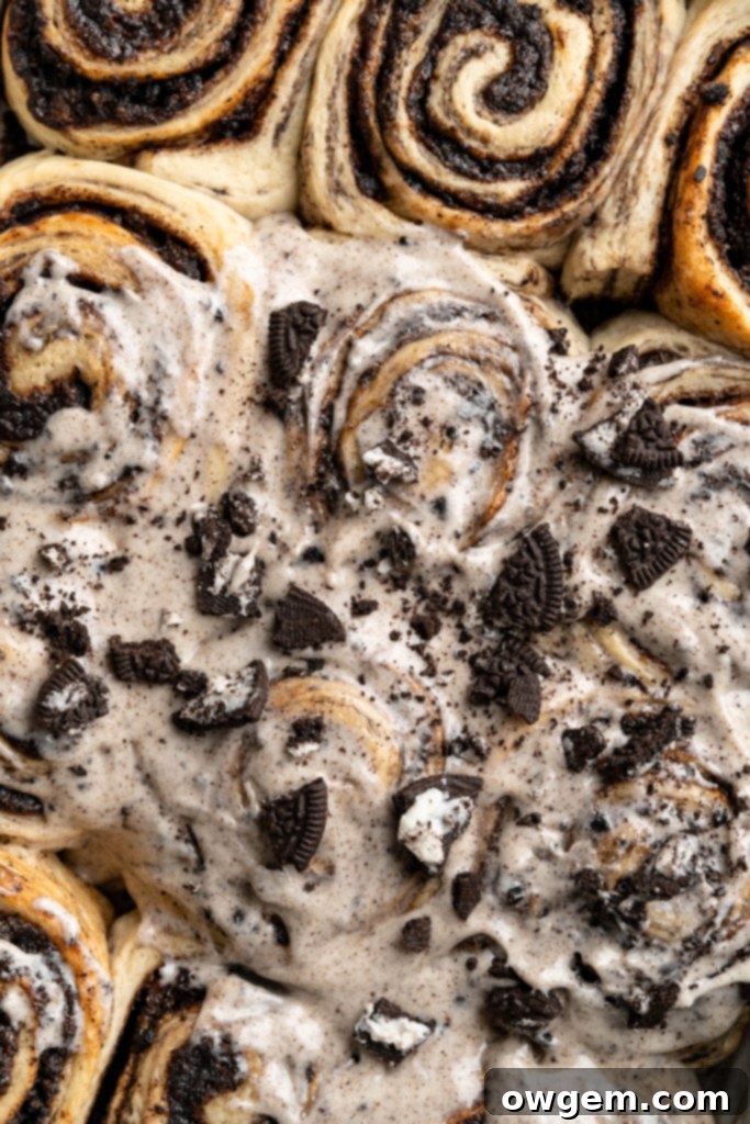 Close-up of Oreo Cookies and Cream Cinnamon Rolls baking in a pan