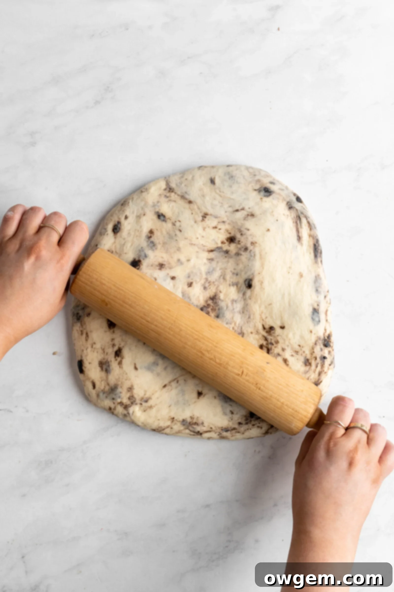 Spreading butter and filling on dough