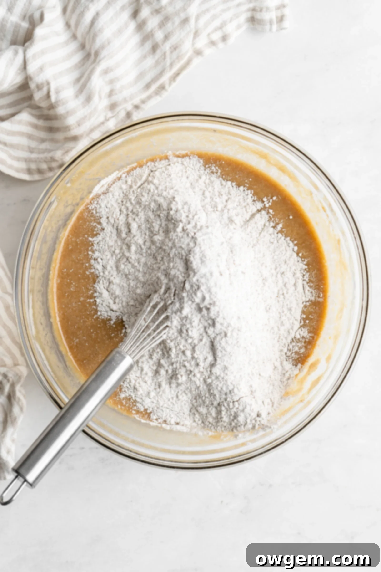 dry ingredients going into wet ingredients