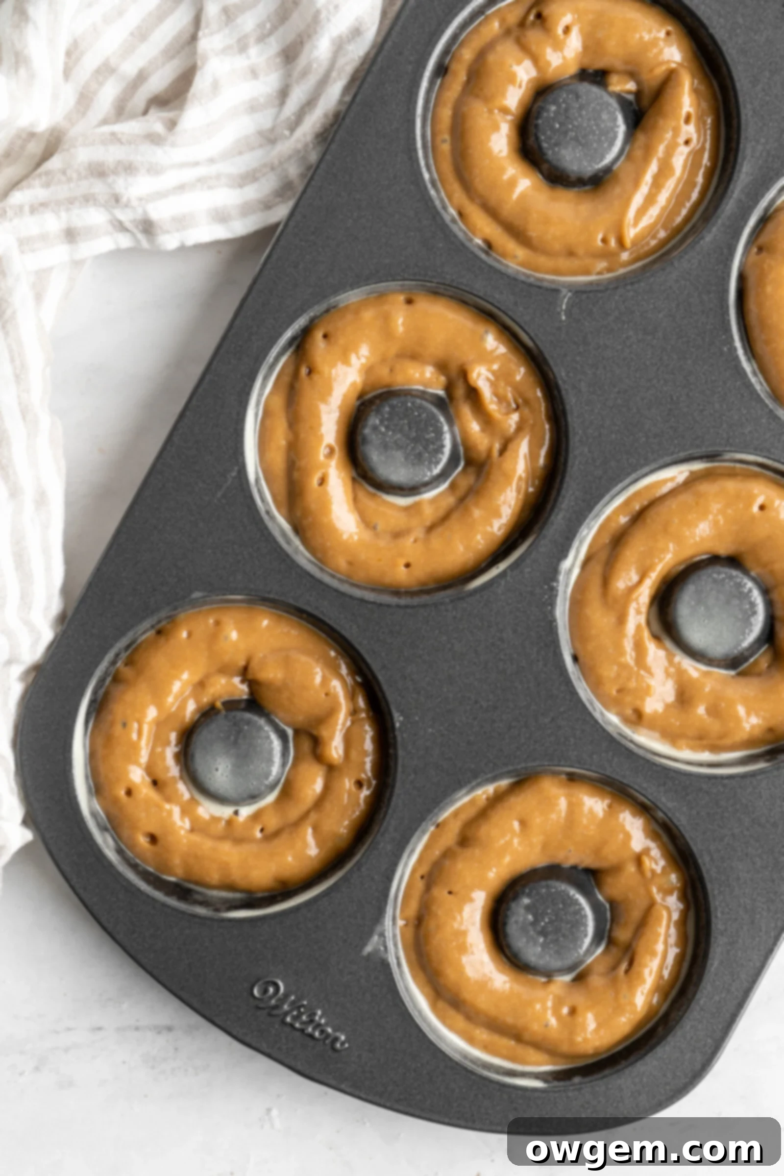 Coffee donuts piped into donut pan