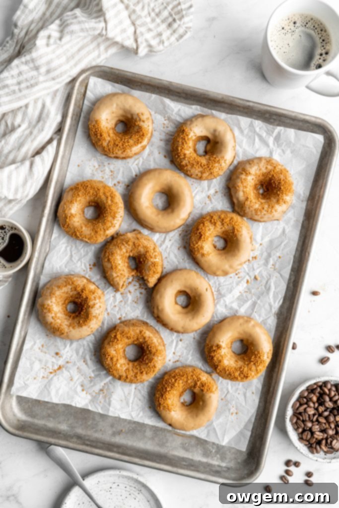 Coffee donuts with coffee glaze sprinkled with crushed biscoff cookies