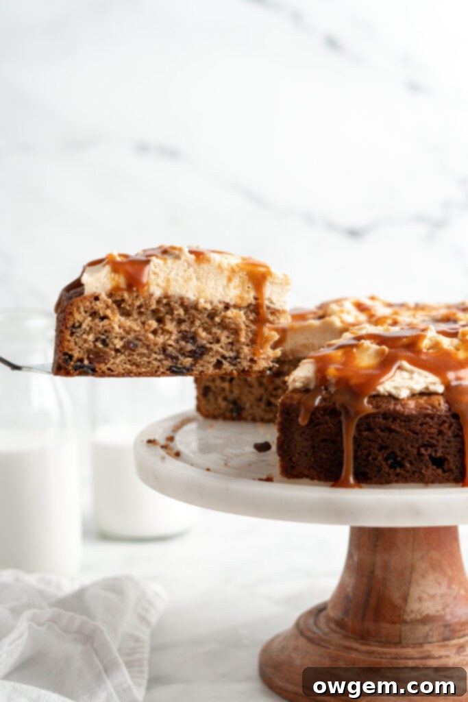 Caramel raisin spice cake slice removed from cake.