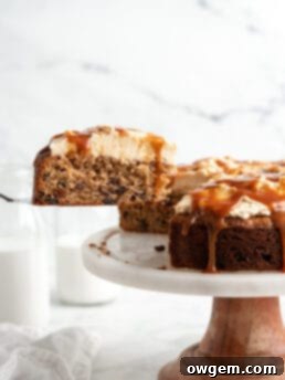 A delectable slice of Caramel Raisin Spice Cake with caramel drizzle.