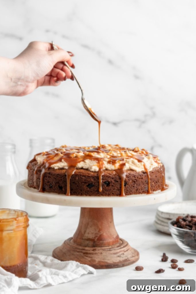 Drizzling caramel over raisin spice cake.