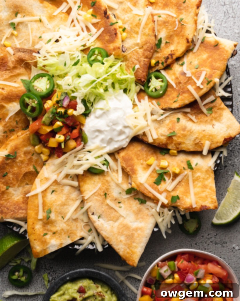 Super crispy quesadillas filled with tropical pineapple lime chicken, monterrey jack cheese, corn, black beans, and peppers