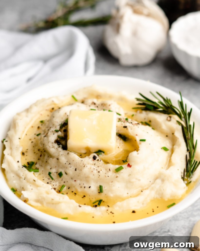 Super creamy buttery garlic mashed potatoes, topped with chives