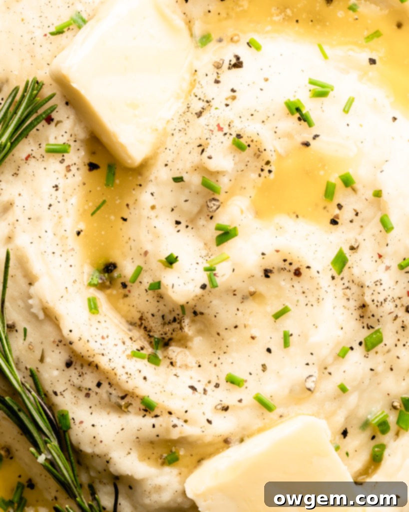Super creamy buttery garlic mashed potatoes, topped with chives