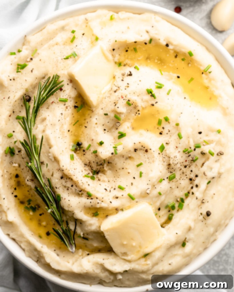 Super creamy buttery garlic mashed potatoes, topped with chives
