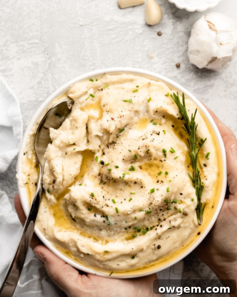 Super creamy buttery garlic mashed potatoes, topped with chives