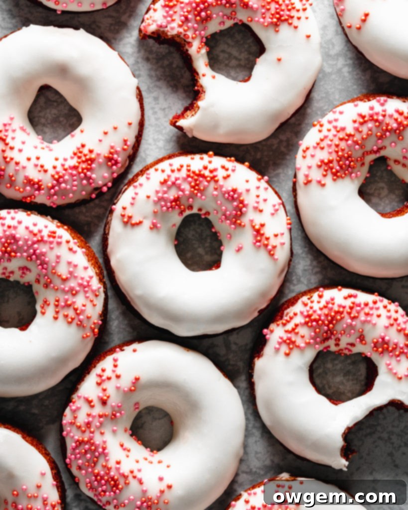 Easy to make baked red velvet donuts are glazed with a cream cheese frosting